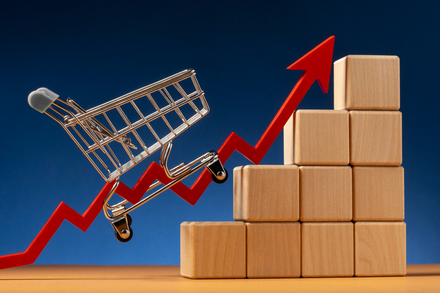 Carrinho de compras subindo gráfico em formato de seta vermelha, simbolizando o crescimento da taxa de conversão no e-commerce.